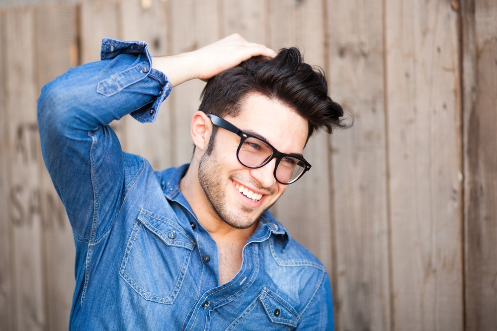 handsome young man smiling outdoors - The Libra Man with Libra Rising